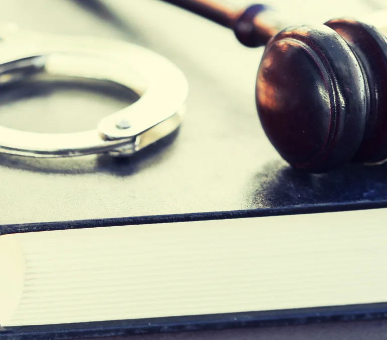 a close up of handcuffs on a book