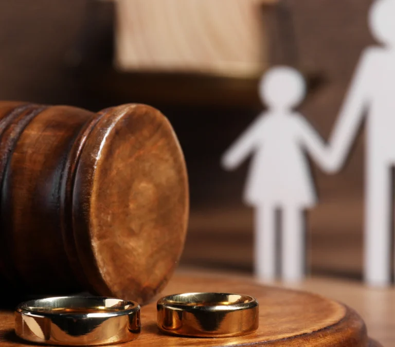 a gavel and rings on a table