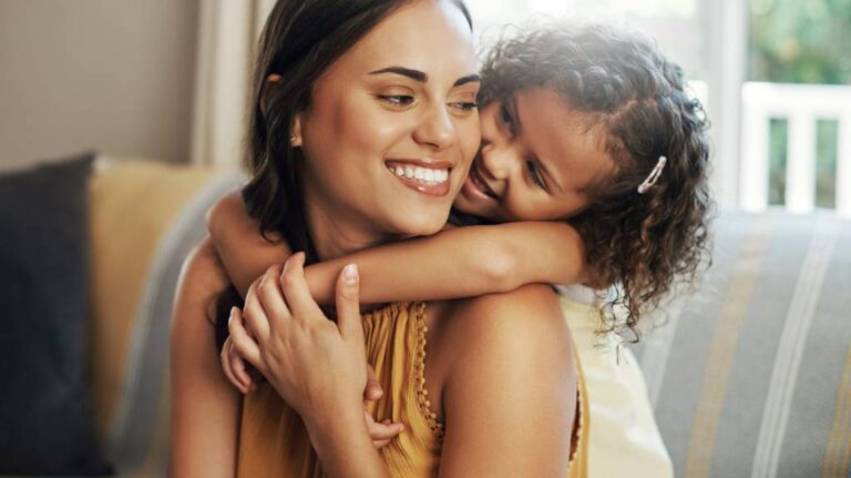 Child with mother in embrace