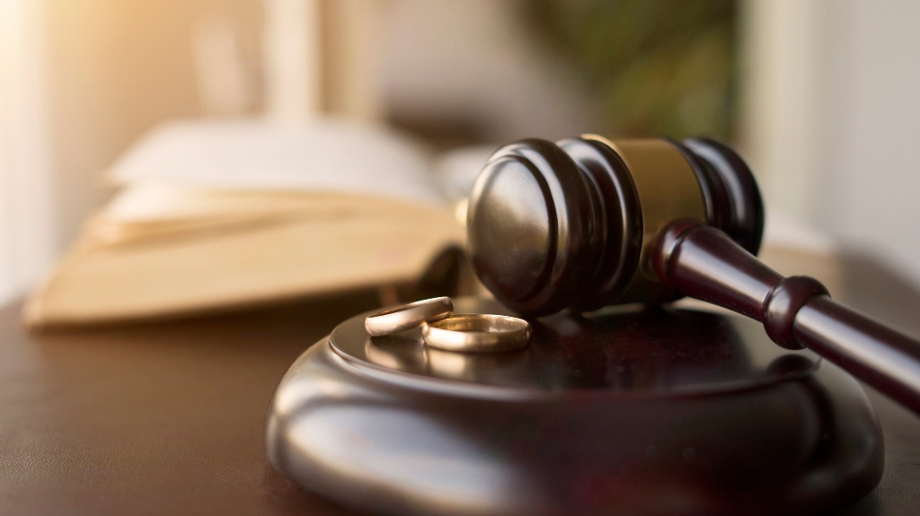 Judge gavel and wedding rings