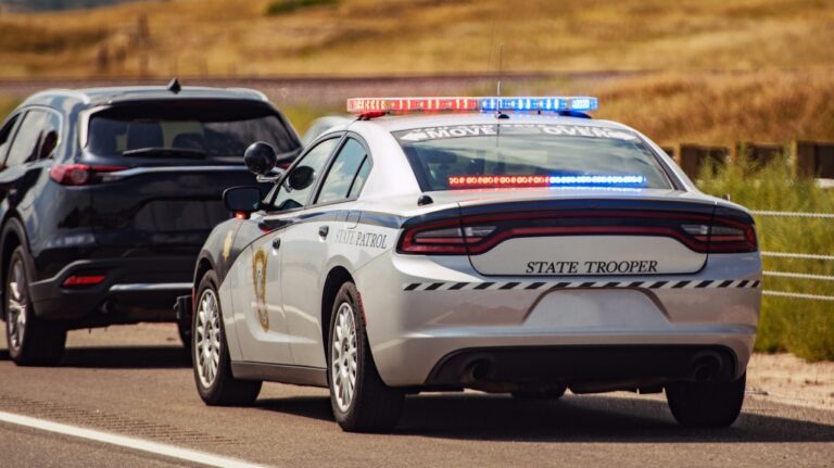 American Highway State Trooper Pulling Over Vehicle For Speeding Reason