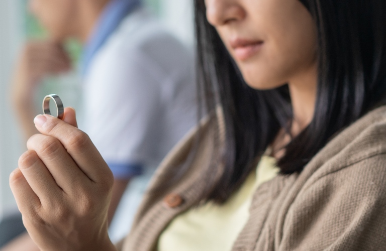 wife looking at wedding ring