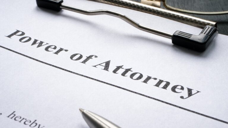 Clipboard with Power of attorney and pen for signing