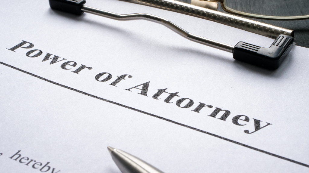 Clipboard with Power of attorney and pen for signing