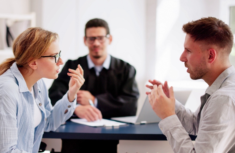 couple talking to each other in a lawyer's office