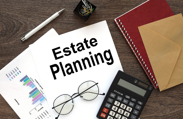 estate planning on the work desk there is a red notepad
