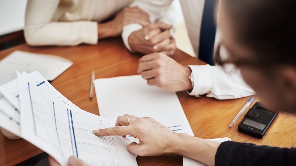 lawyer is consulting clients about estate planning for small business