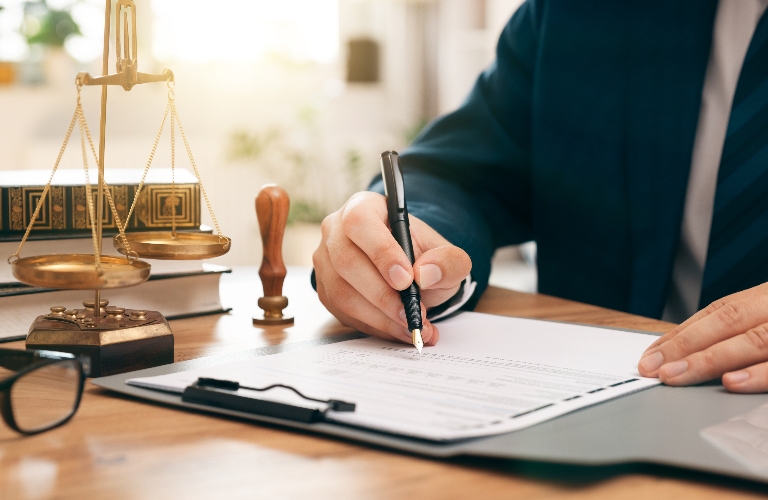 Lawyer is signing documents