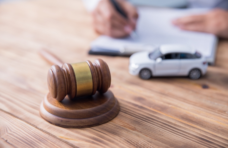 Judge's gavel, toy car and lawyer