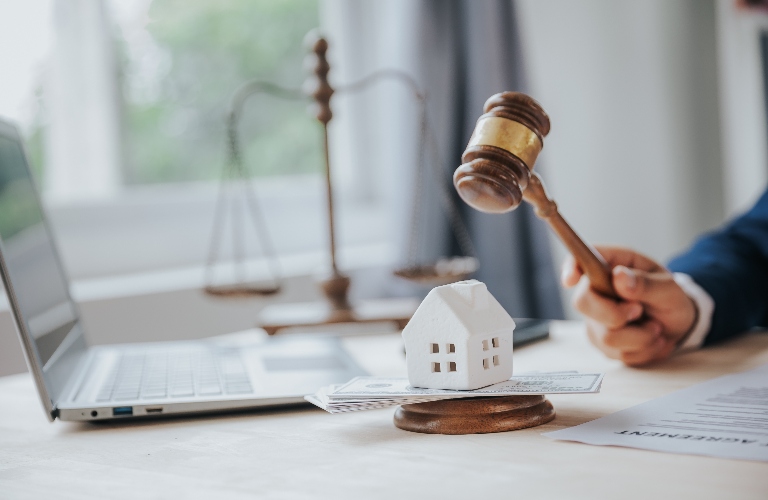 Toy house model and judge's gavel