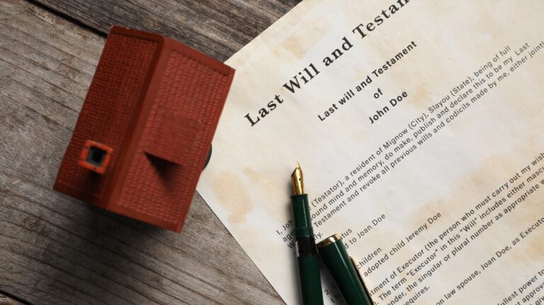Last Will and Testament with fountain pen and house model