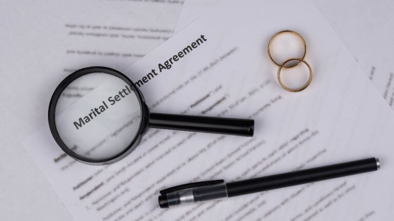 Marital Settlement Agreement, pen and wedding rings