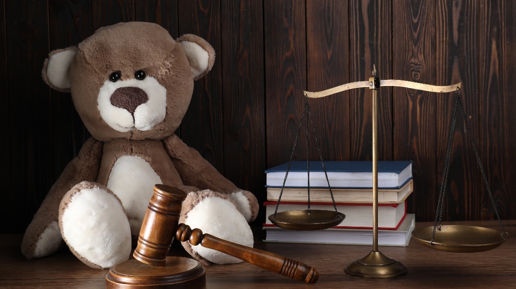 Toy bear and judge's gavel
