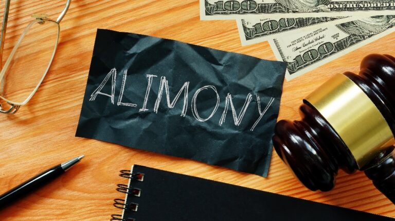 Alimony concept, judge's gavel, pen and money