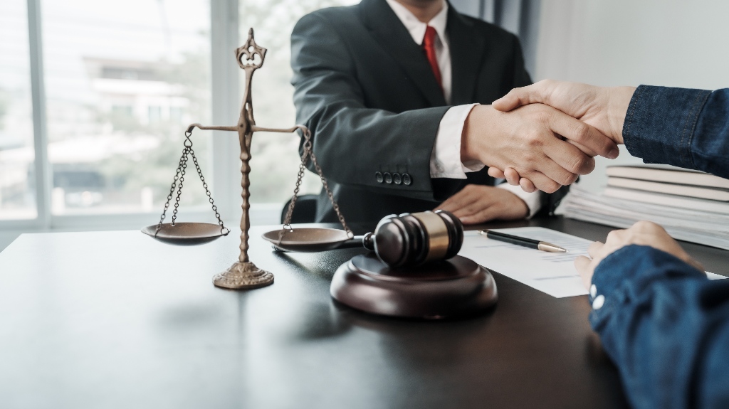 lawyer is shaking hands with the client