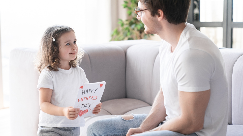 Happy father with little daughter